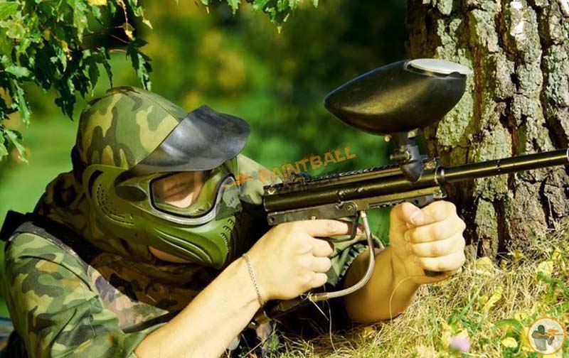 Playing Paintball In Woods