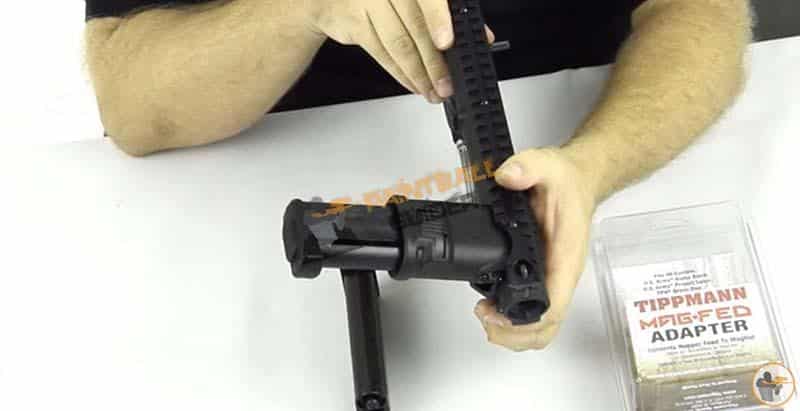 Inserting The Magazine Into The Adapter For Tippmann 98 Custom Paintball Gun